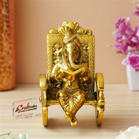Golden Metal Handcrafted Lord Ganesha Idol Reading Book on Rocking Cha ...