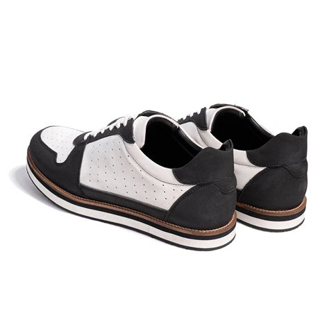 White and black sneaker with perforations – The Alternate