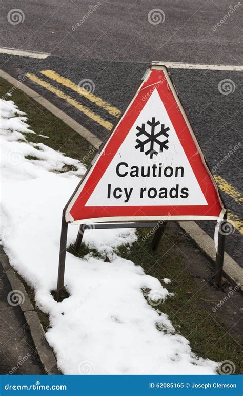 Caution Icy Roads Warning Sign Stock Image - Image of caution, winter ...