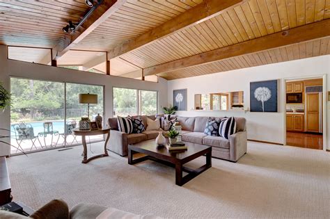 Classic mid-century ranch home with wood beam ceilings & walls of glass ...