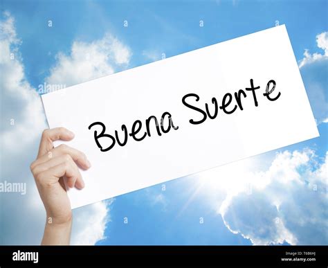Buena Suerte( Good Luck in Spanish) Sign on white paper. Man Hand ...