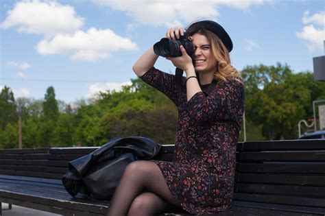 Girl with the digital camera is miming | Premium Photo