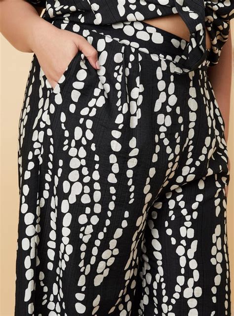 Buy Women Printed Wide-Leg Trousers Online at just Rs. 1099.0 ...