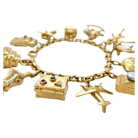 Unique Tiffany and Co. 18K Yellow Gold Charm Bracelet For Sale at 1stDibs