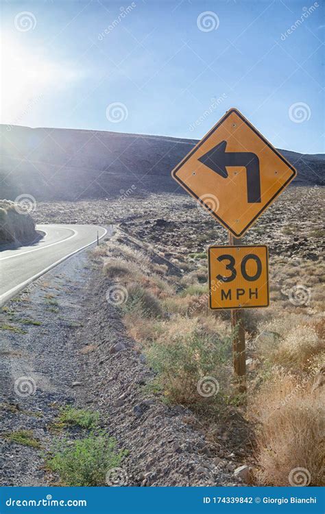 Road Sign Indicates a Left Turn Stock Photo - Image of backlight, turn ...