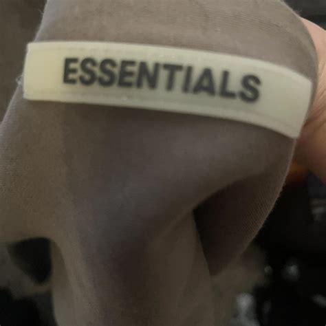 olive green Essentials hoodie size S | Depop