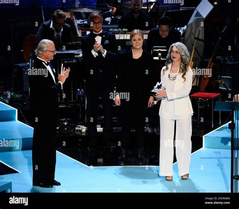 Scottish percussionist Evelyn Glennie, right, displays her trophy after ...