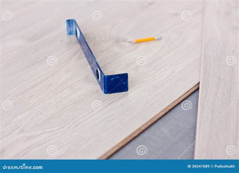 Laying laminate flooring stock image. Image of buildings - 36547689