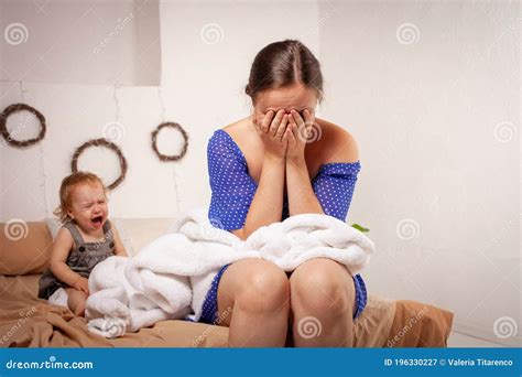 Mom is Tired of the Baby, Wants To Rest and Sleep. the Child Screams ...