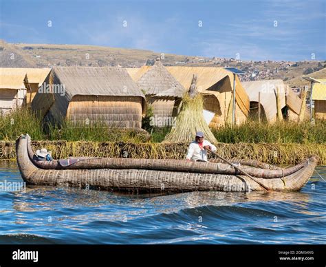 Lake Titicaca, Peru - 17 May 2018; two native people in shot Situated ...
