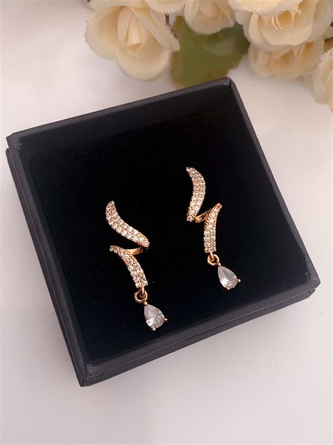 American Diamond Rose Gold Plated Hanging Fancy Earrings – Belleza Jewels