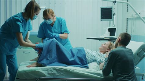 Pregnant Women In Labor Pushing Pregnant Young Woman Pushing To Give