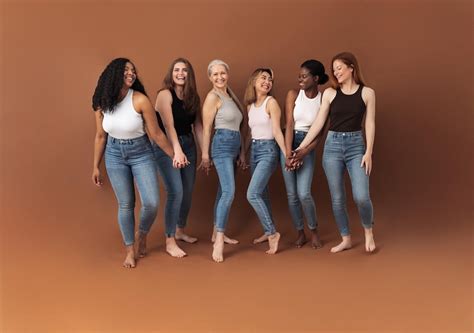 Cheerful women of different body types and ages standing together in ...