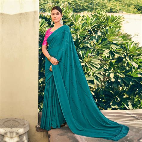 Teal Blue Printed Georgette Saree With Tassels