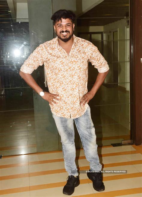 Kalabhavan Shajohn smiles for the camera during the audio launch ...