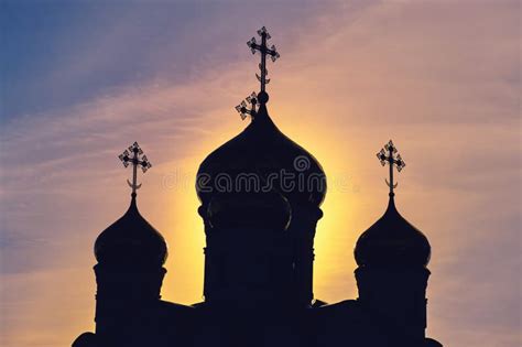 The Silhouette of an Orthodox Church with Crosses on the Domes. Sunrise ...