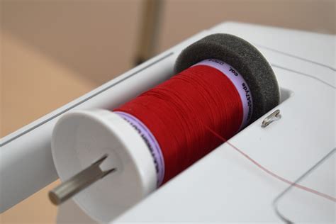 Image result for How to Use Large Thread Spool On Machine
