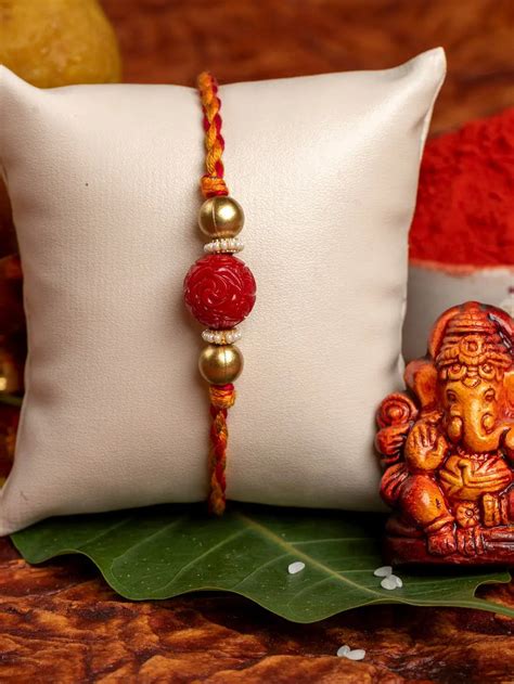 Handmade Red Carved Bead Focal Golden Rakhi for Men and Boys with Roli ...