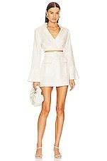 MATTHEW BRUCH Long Sleeve Wrap Crop Top in Cream | REVOLVE