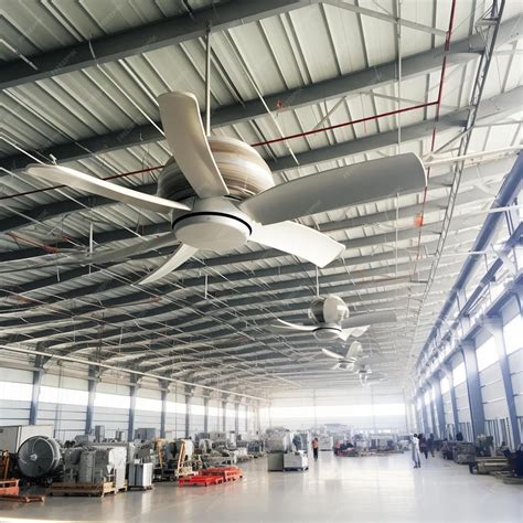 Premium Photo | Commercial hvls ceiling fan big industrial fans at roof ...
