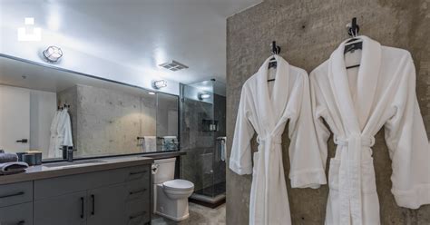 The Ritz-Carlton bath robes hanging in luxury bathroom