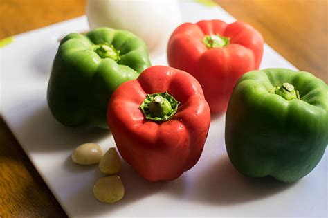 A bowl of slow cooker pepper steak, served over white rice