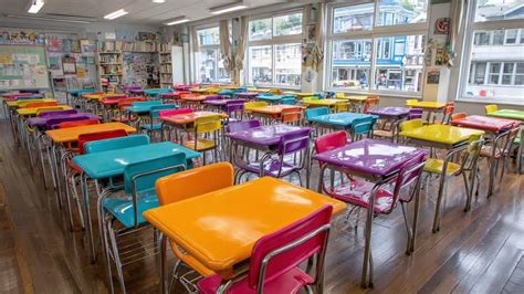 A Vibrant Classroom Scene with Colorful Desks and Brightly Lit Windows ...