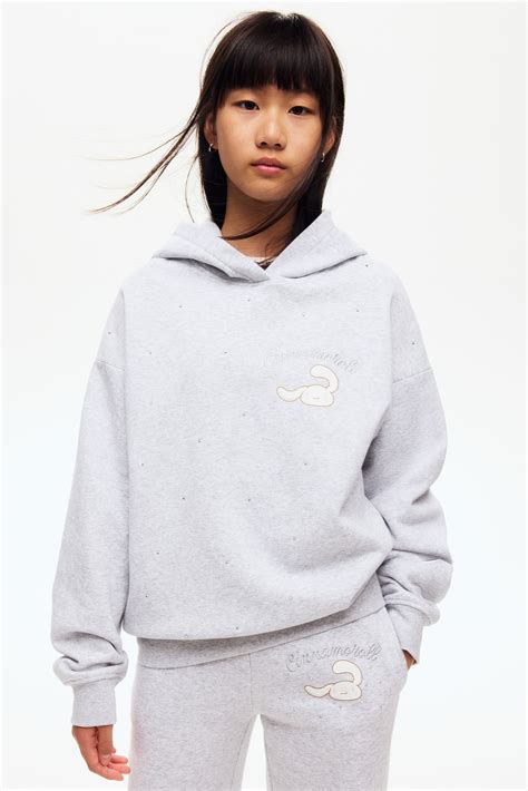 Motif-detail hoodie - Light grey marl/Cinnamoroll - Kids | H&M IN
