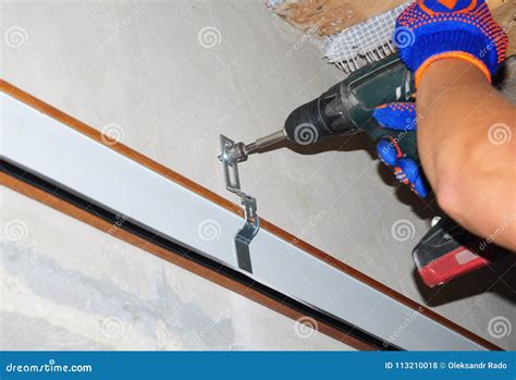 Building Contractor Installing Garage Door Opener. Stock Photo - Image ...