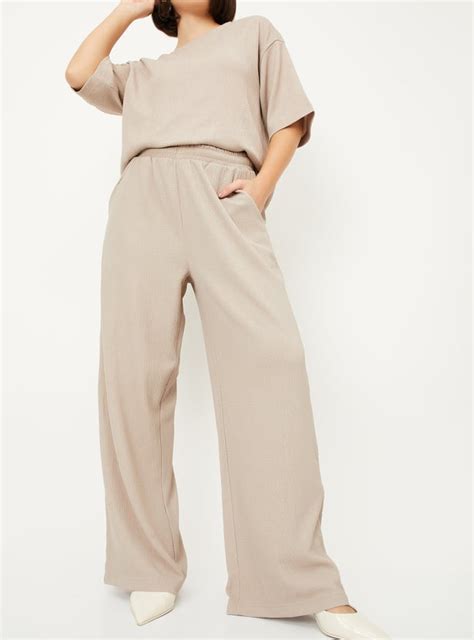 Buy Women Textured Wide Leg Trousers Online at just Rs. 699.0 ...