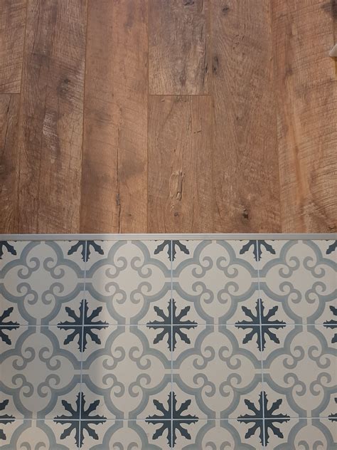 Blue and White Tile Floor with Wooden Border