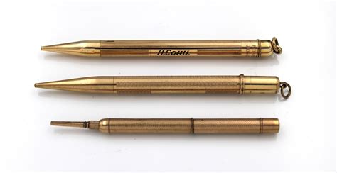 Lot - Three yellow metal (rolled gold) propelling pencils. (3)