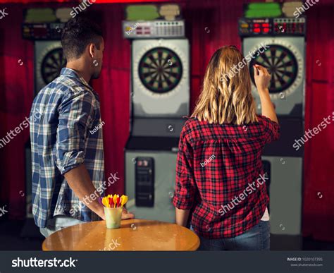 Playing darts has never been so sexy, strip style!