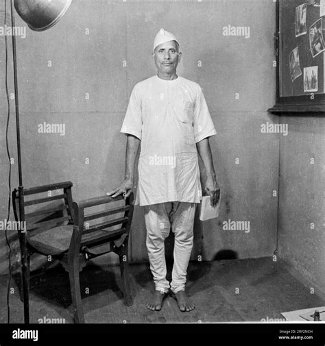 old vintage 1900s black and white studio portrait of Indian man wearing ...