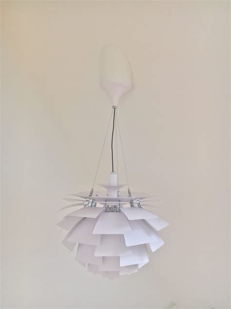 Designer lamp on an angled ceiling. – Vest Design