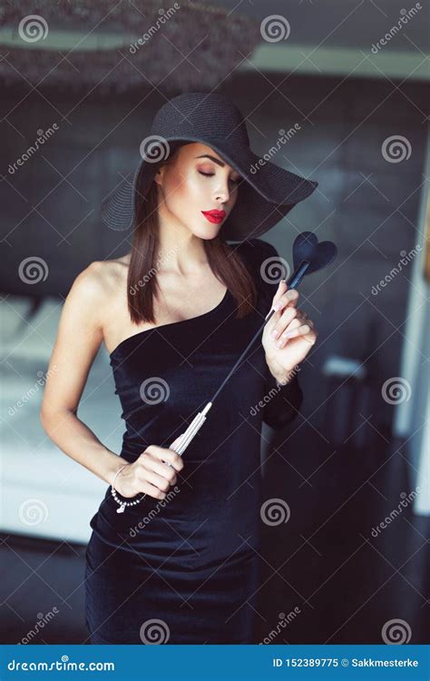 Dominant Woman Posing with Whip Indoors Stock Image - Image of hotel ...