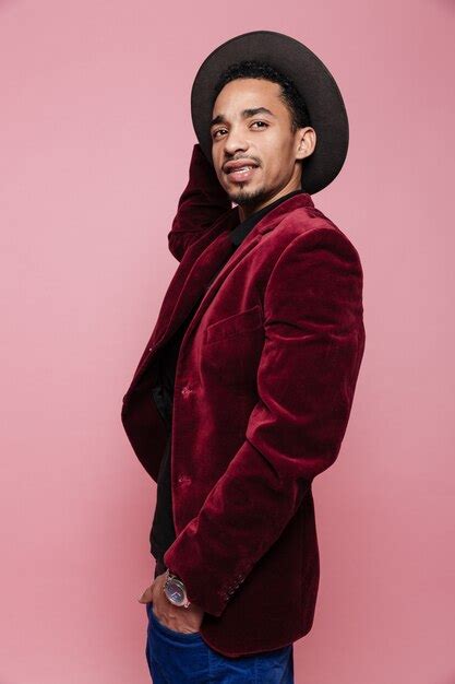 Afro american man in hat and jacket standing and posing | Premium Photo