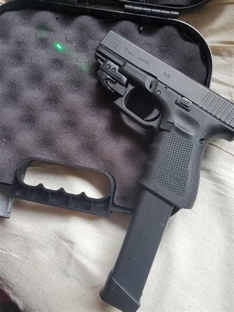 My Glock 19 Gen 4 w/ Crimson Trace green laser & 33 round extended ...