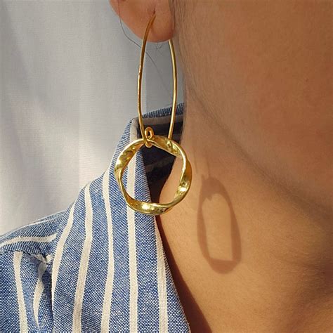 Buy Handmade Twisted Loop Dangler Brass Earrings Online On Zwende