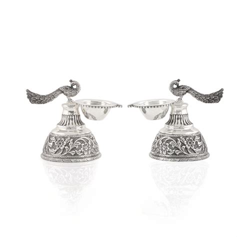 silver-deepam-with-floral-peacock-design – Krishna Jewellers Pearls and ...