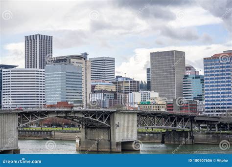 Morrison Bridge Over Willamette River Overlooking a Business Building ...