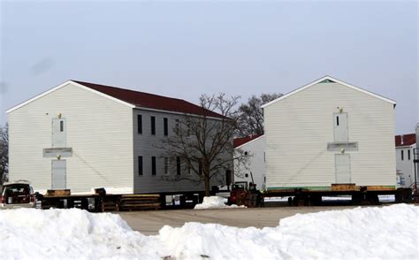 Photo Essay: Contractor moves first two World War II-era barracks at ...
