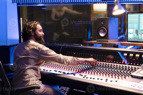 Music engineer applying mix and master techniques on old recordings ...