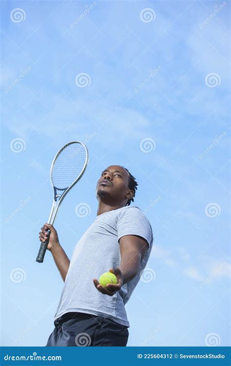 Fierce Male African American Tennis Player is Serving the Ball Stock ...