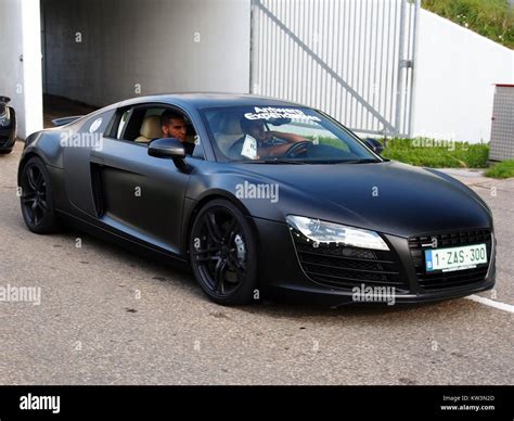 A black Audi R8 sports car at the Zandvoort circuit during a 2014 event. The car's sleek design ...