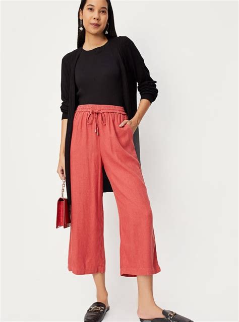 Buy Women Solid Woven Relaxed Fit Trousers Online at just Rs. 999.0 ...