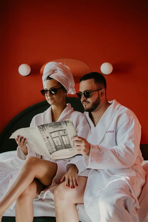 Two woman wearing EDITION bath robes and towels wrapping their hair