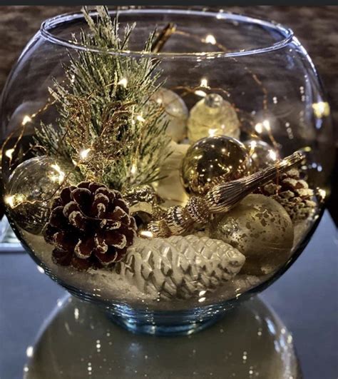 Xmas decoration ideas. A glass bowl filled with pinecones, ornaments ...