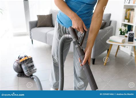 Woman Vacuuming the Floor at Home Stock Photo - Image of housekeeper ...