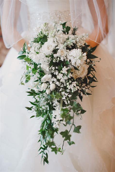 Cascading bouquet. Pictured: Bouvardia, Lilly of the Valley, Hyacinth ...